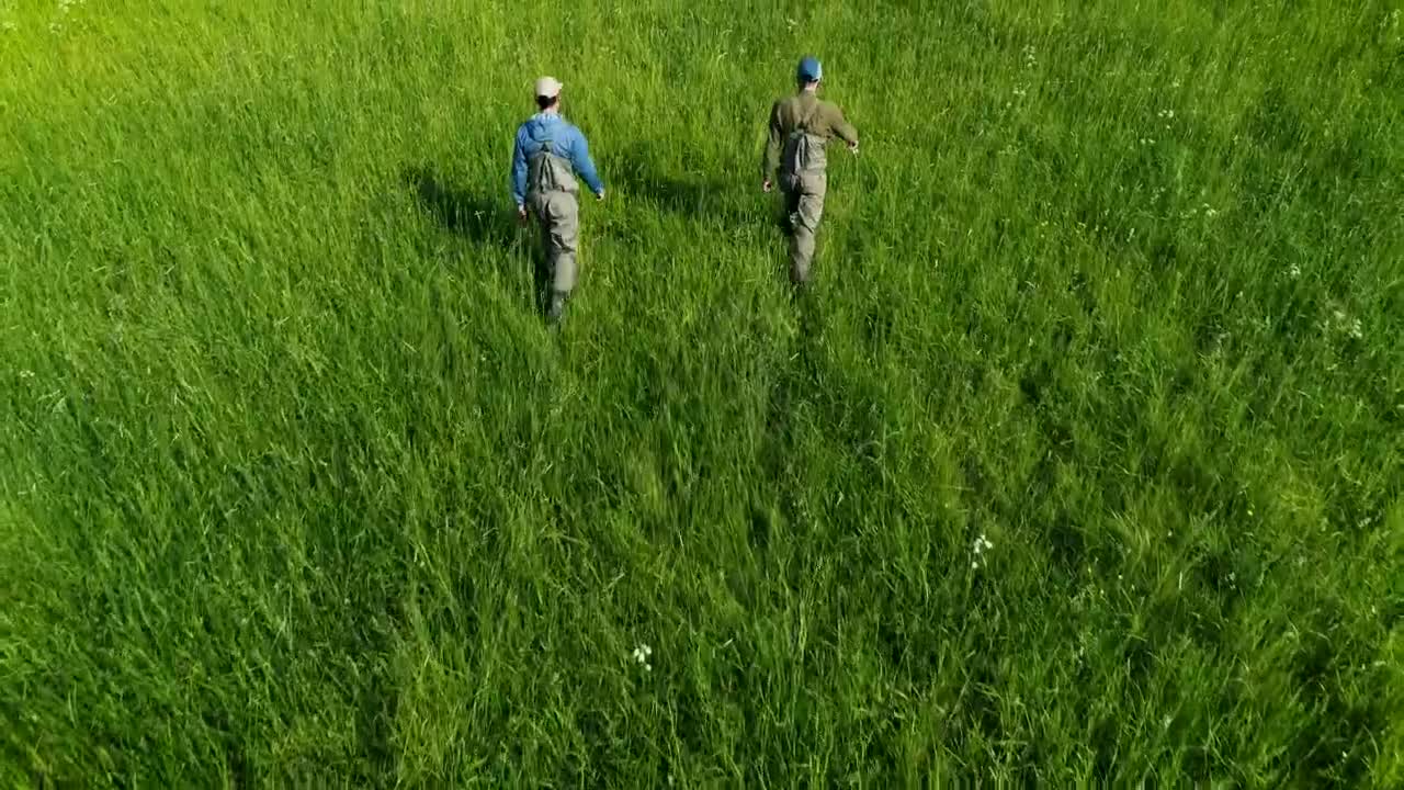 Stock Video Fishermen Walking On Green High Grass Live Wallpaper For PC