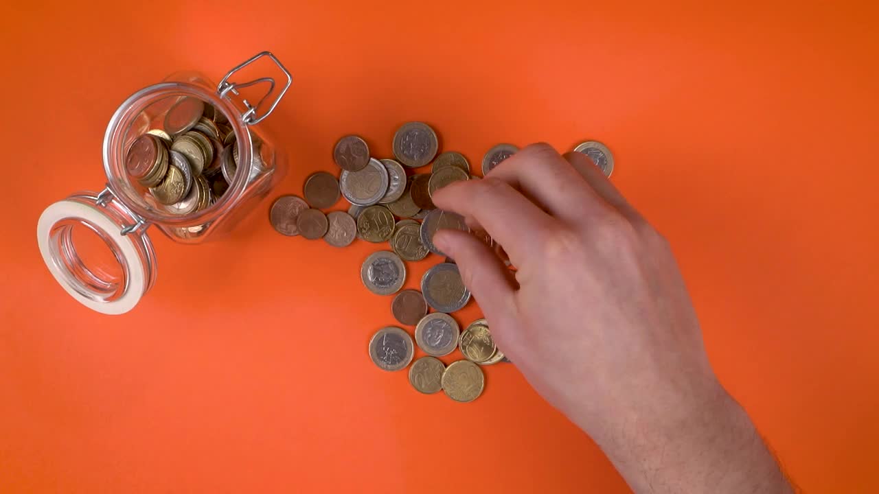 Stock Video Filling Jar Glass With Coins Live Wallpaper For PC