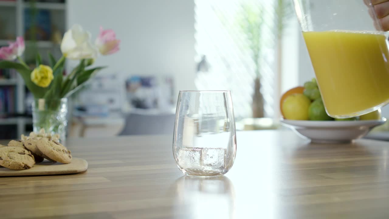 Stock Video Filling A Glass On The Table With Orange Juice Live Wallpaper For PC