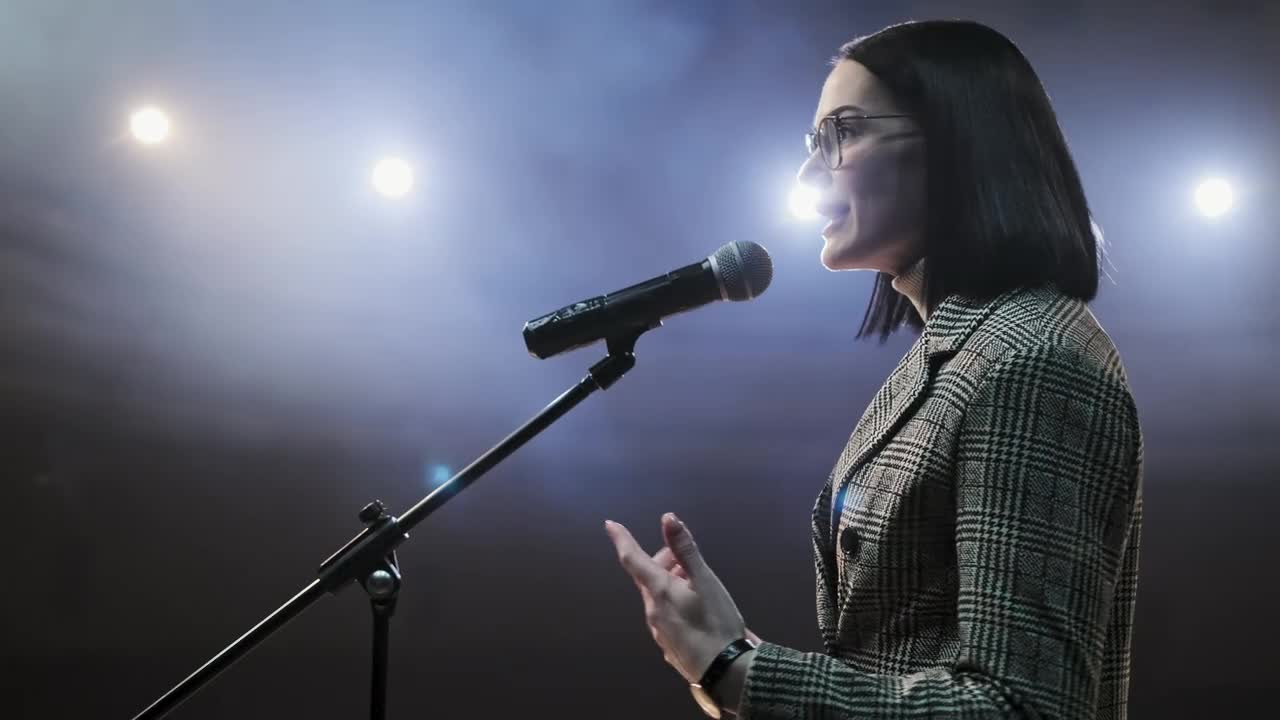 Stock Video Female Speaker Giving A Talk On Stage Live Wallpaper For PC