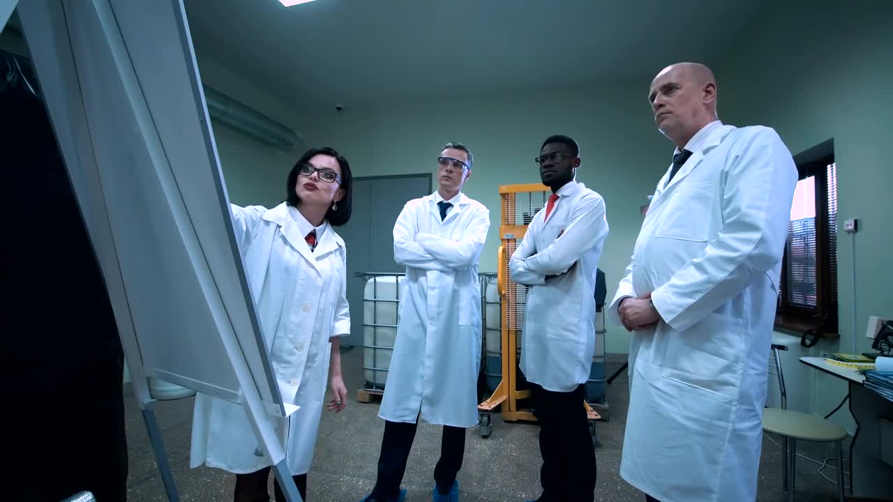 Stock Video Female Scientist Explaining An Idea On The Board Live Wallpaper For PC