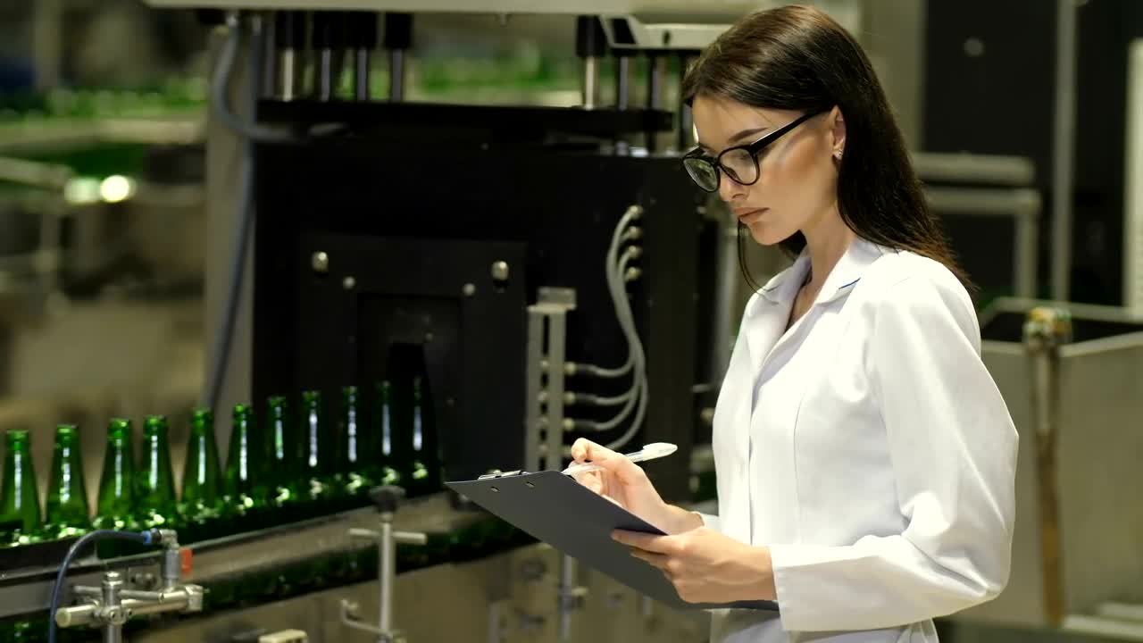 Stock Video Female Inspector Checking Beer Production Live Wallpaper For PC