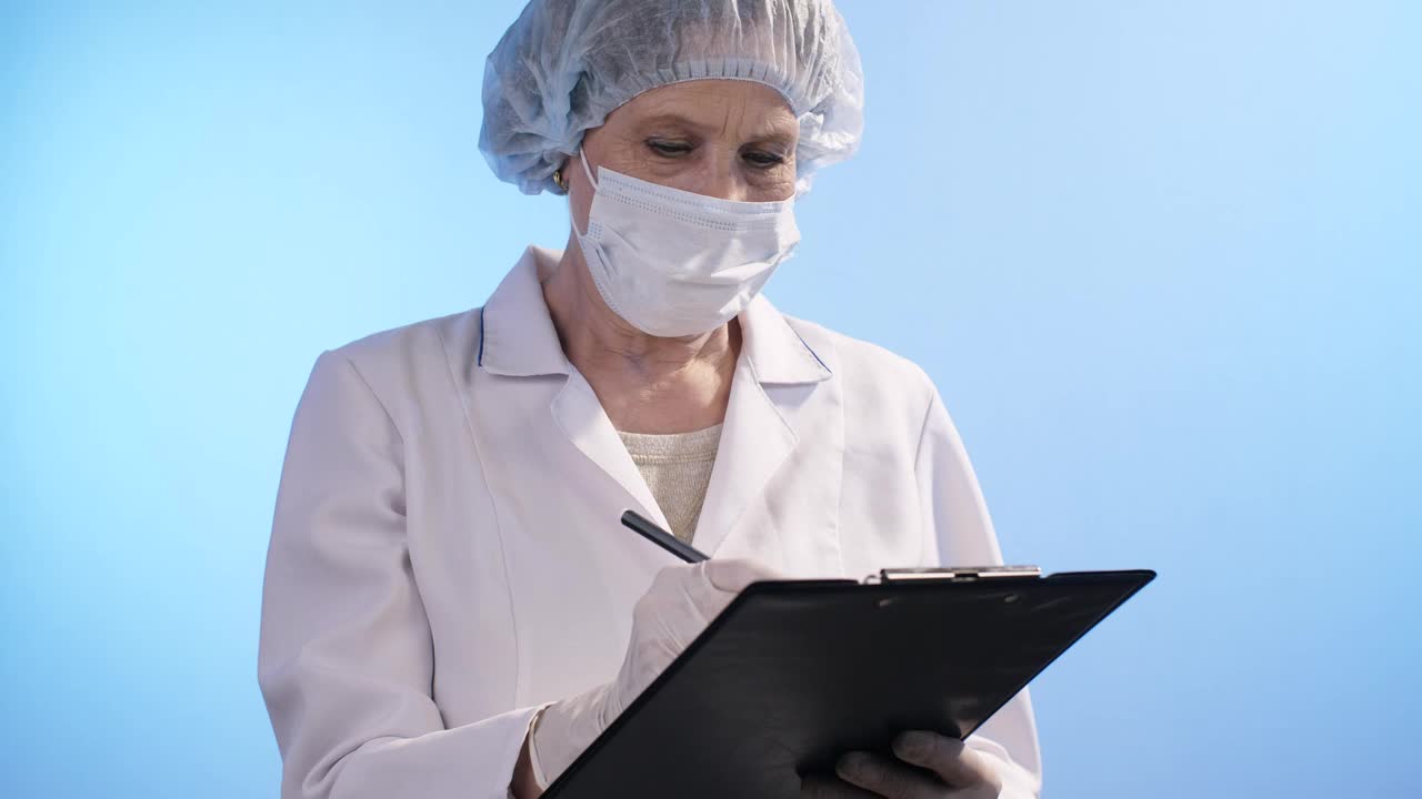 Stock Video Female Doctor Writes In Her Notebook Live Wallpaper For PC