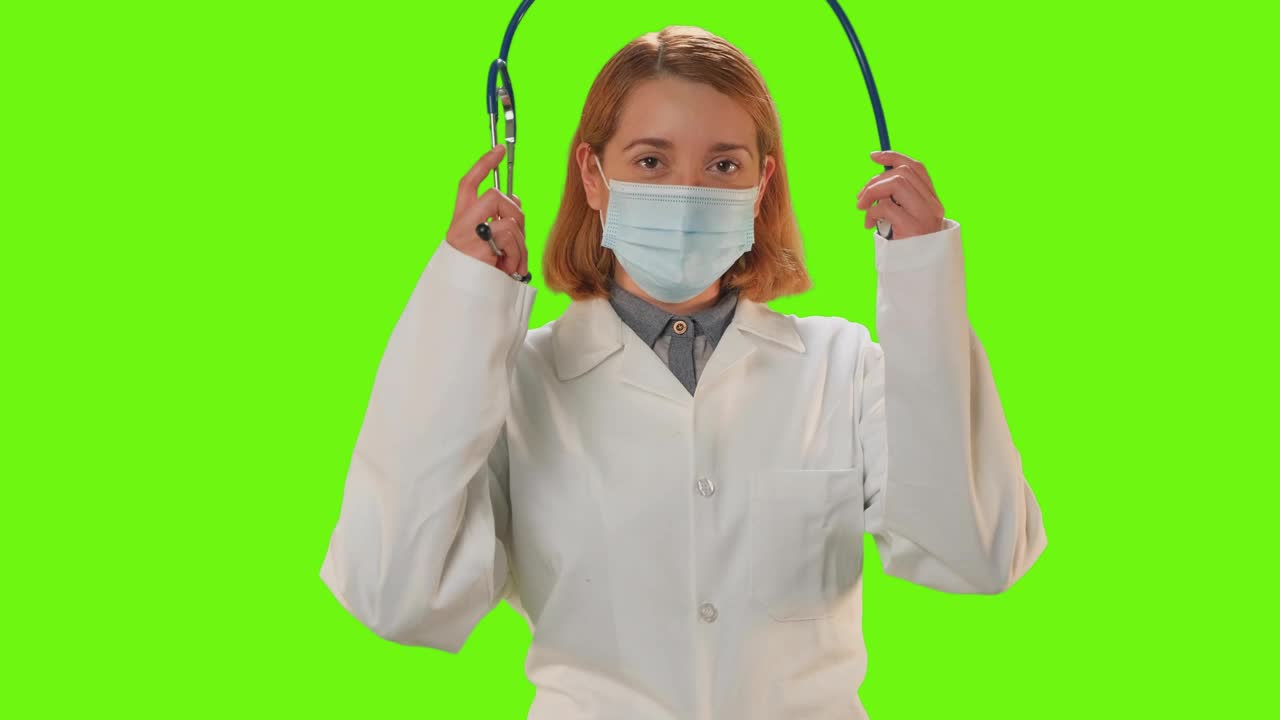 Stock Video Female Doctor With Mask On A Green Background Live Wallpaper For PC