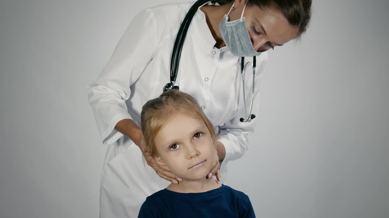 Stock Video Female Doctor Checking The Lymph Node Of The Child Live Wallpaper For PC