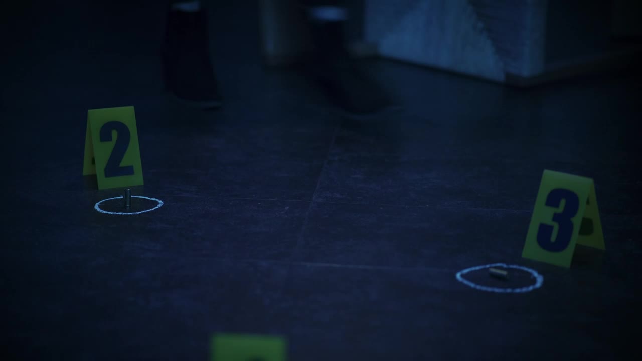 Stock Video Female Detective Analyzes Bullet Casings At A Crime Scene Live Wallpaper For PC