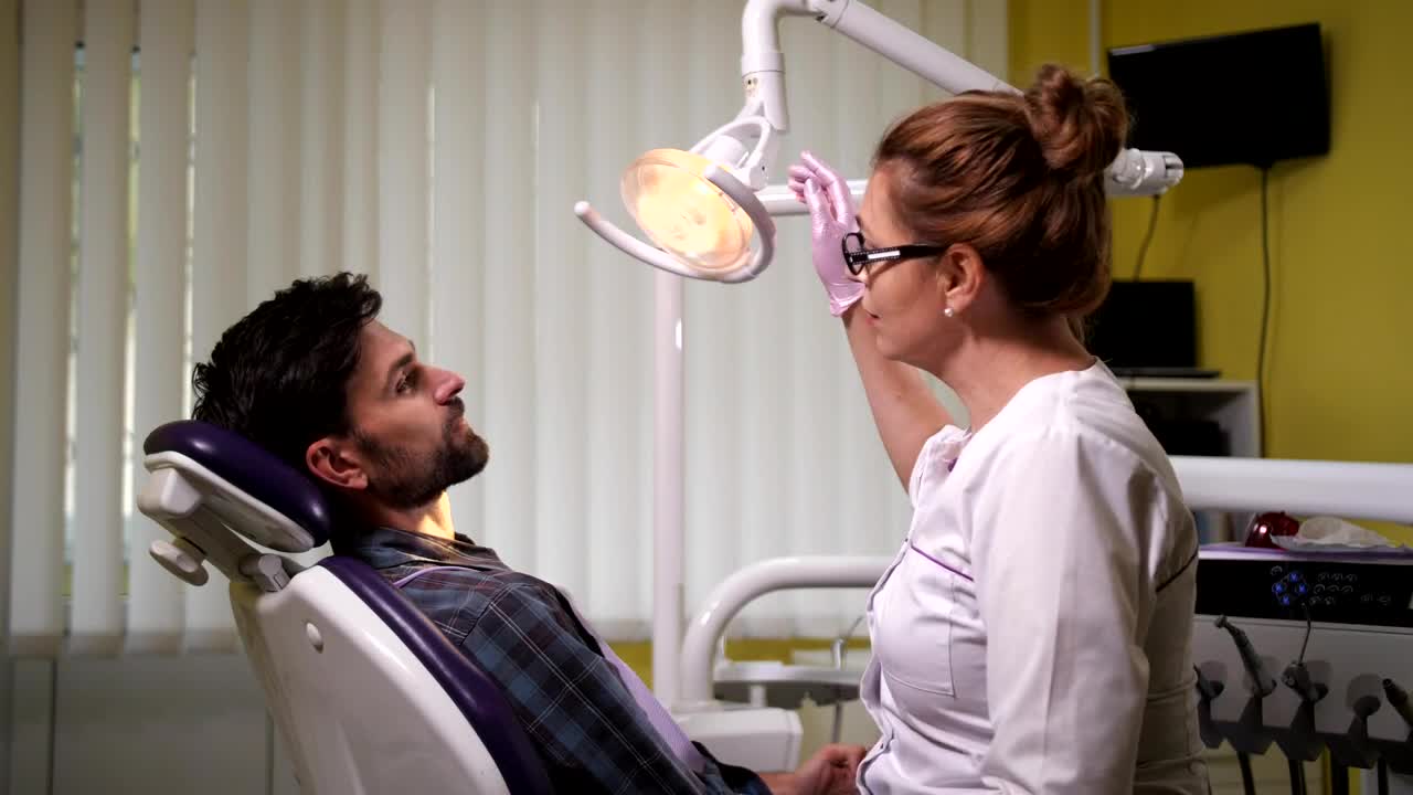 Stock Video Female Dentist Checking Her Patient Live Wallpaper For PC