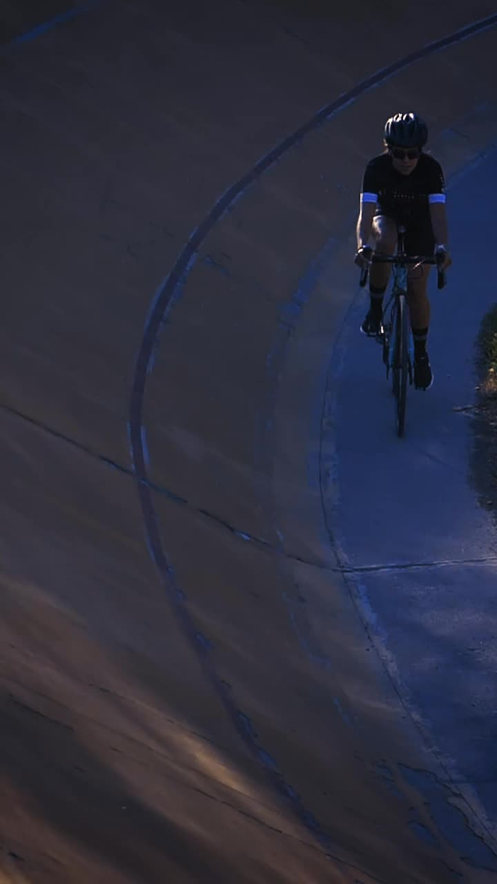 Stock Video Female Cyclist Riding Down A Cycling Track By The Edge Live Wallpaper For PC