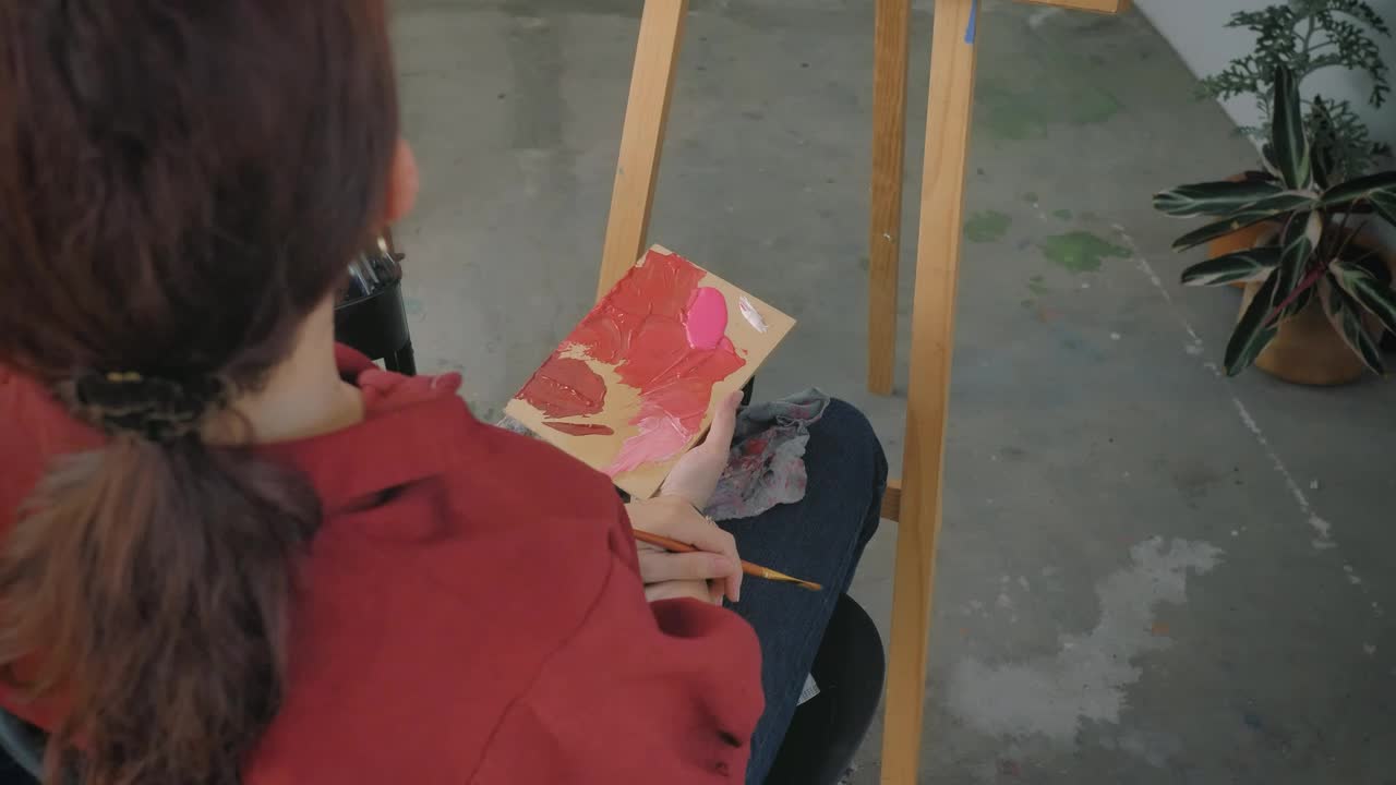 Stock Video Female Artist Painting A Picture In A Workshop Live Wallpaper For PC