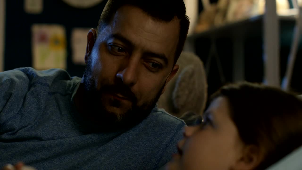 Stock Video Father Telling A Bedtime Story To His Daughter Live Wallpaper For PC