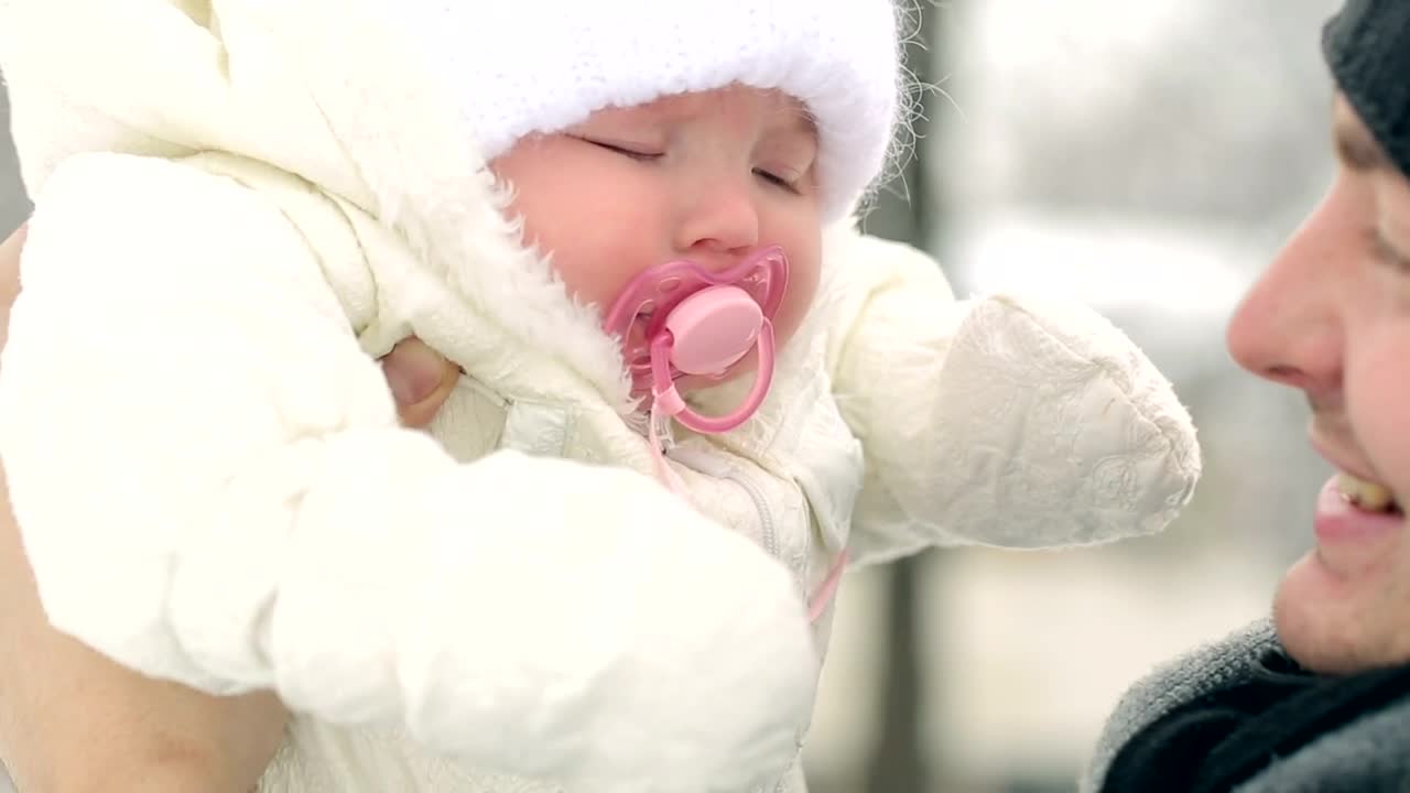 Stock Video Father Looking And Kissing His Baby In Winter Live Wallpaper For PC