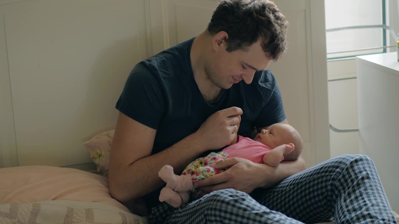 Stock Video Father Holding A Newborns Hand Live Wallpaper For PC