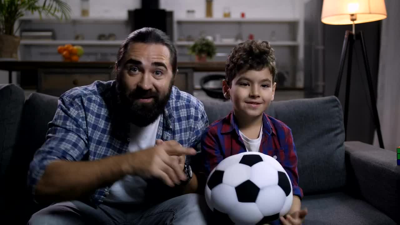 Stock Video Father And Son Watching Sport Live Wallpaper For PC
