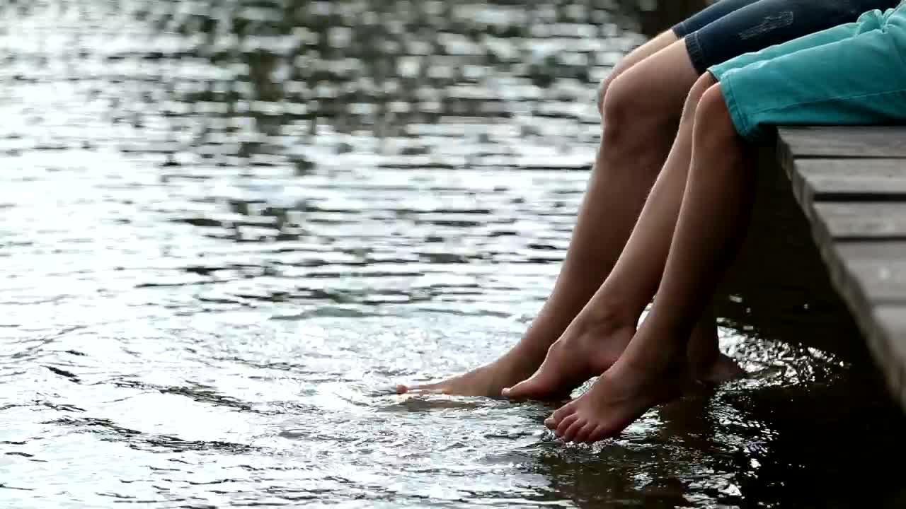 Stock Video Father And Son Sitting On A Pier Live Wallpaper For PC
