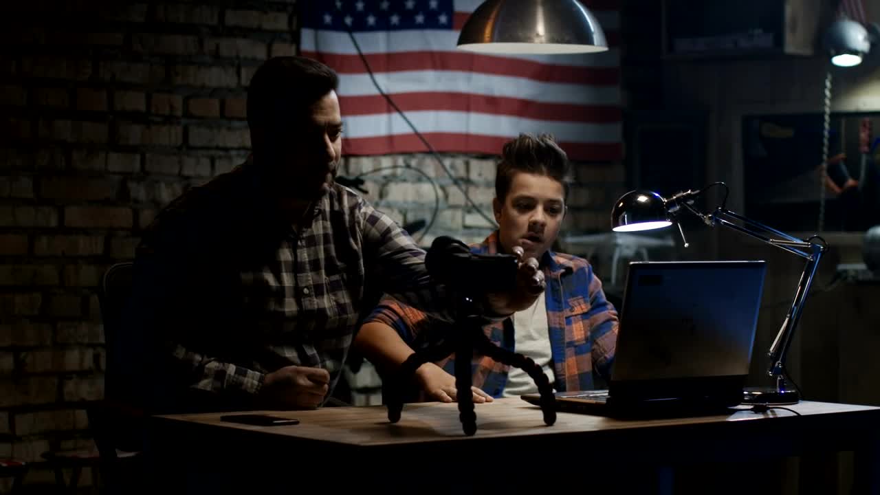 Stock Video Father And Son Making A Video In The Garage Live Wallpaper For PC