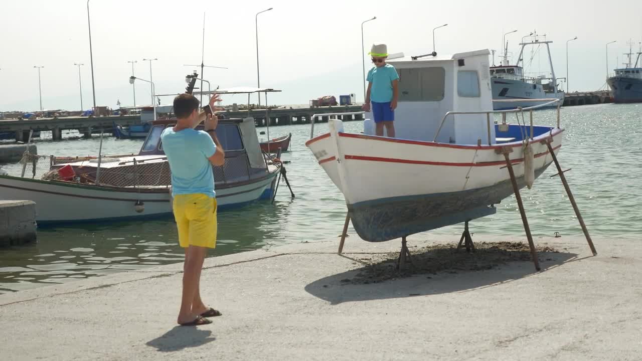 Stock Video Father And Son In A Small Harbor Live Wallpaper For PC