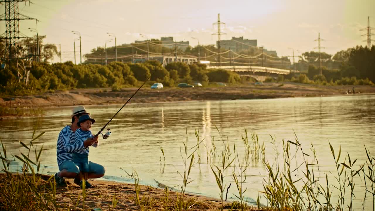 Stock Video Father And His Son Fishing On The Shore Of A Live Wallpaper For PC