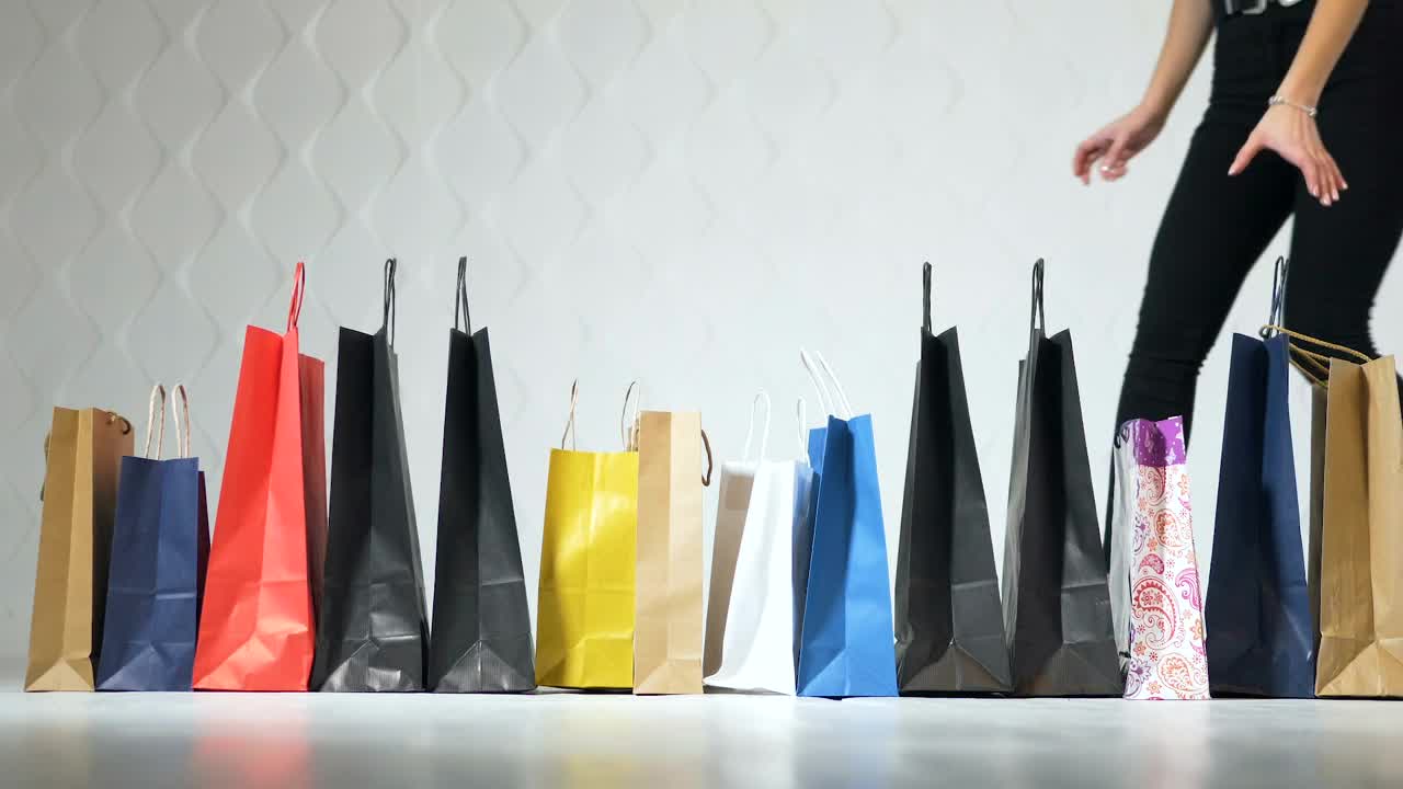 Stock Video Fashionable Women Pick Up Shopping Bags On White Background Live Wallpaper For PC