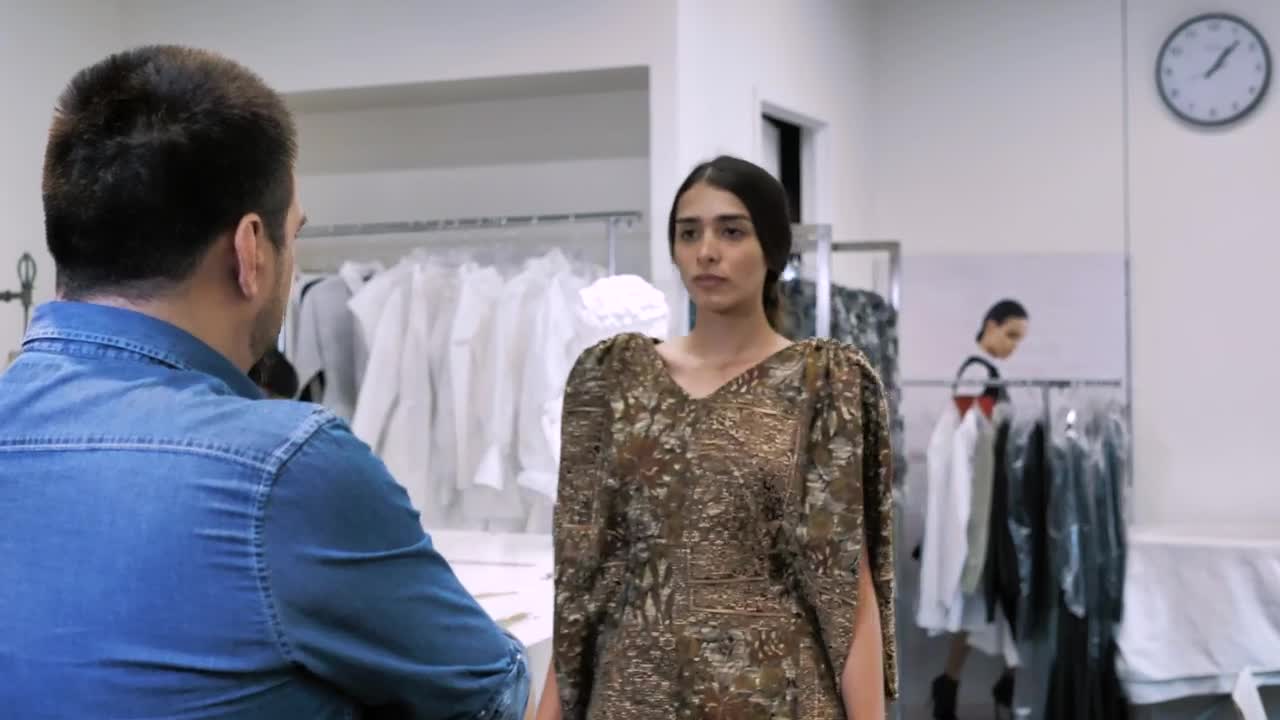 Stock Video Fashion Designer Fits A Brown Dress Live Wallpaper For PC