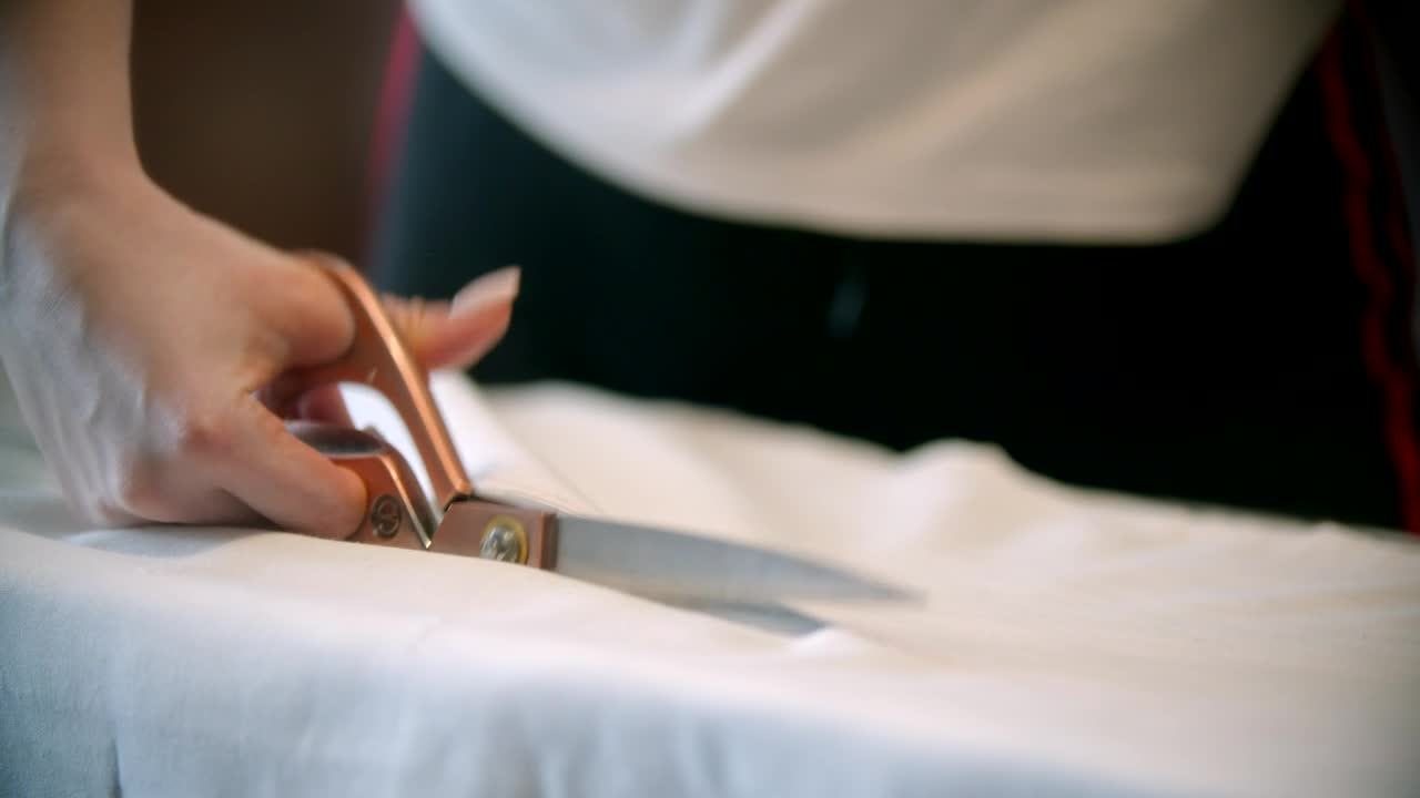 Stock Video Fashion Designer Cutting Fabric With A Scissor Live Wallpaper For PC