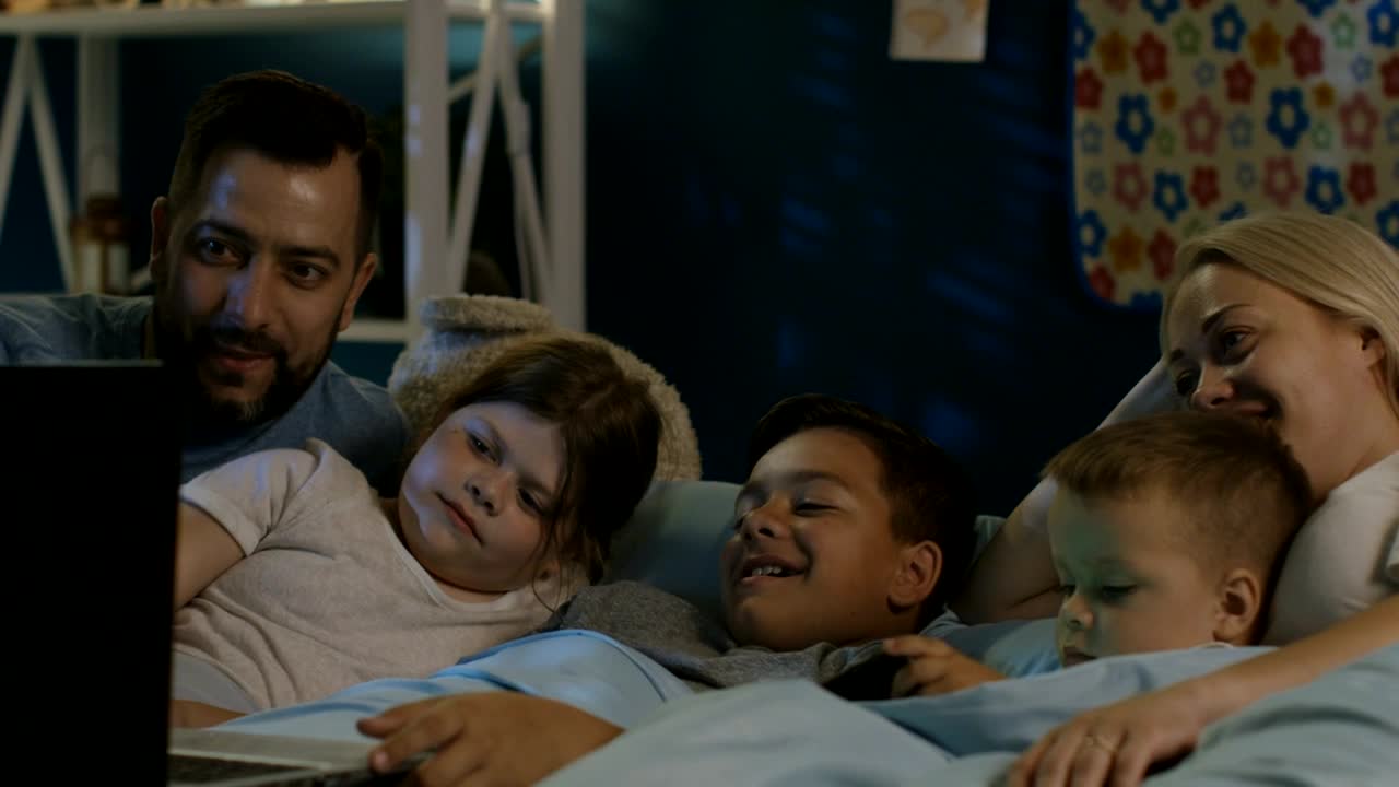 Stock Video Family Watching Laptop At Night Live Wallpaper For PC