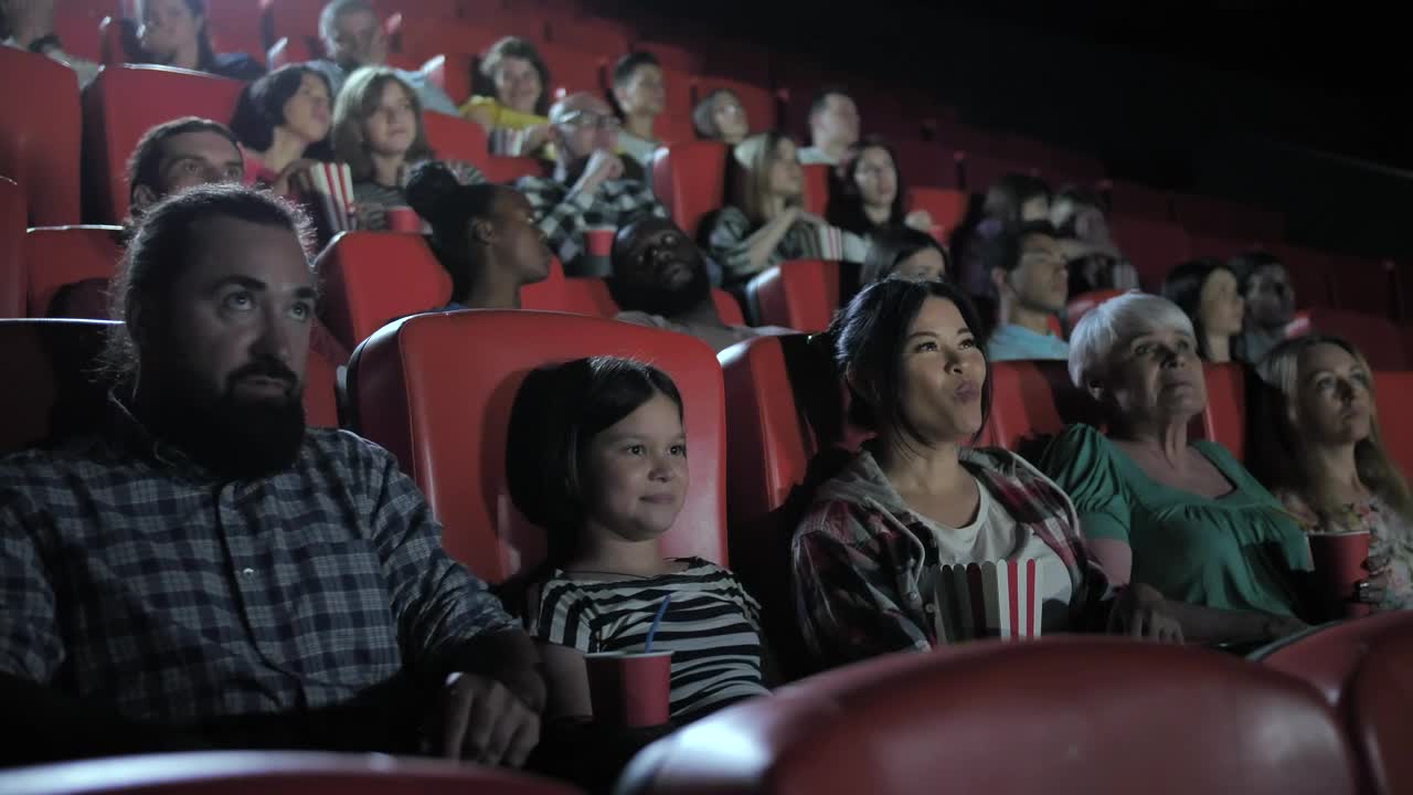 Stock Video Family Watching A Film Together In A Cinema Live Wallpaper For PC
