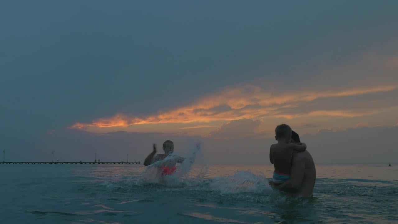 Stock Video Family Splashing Out In The Ocean Live Wallpaper For PC
