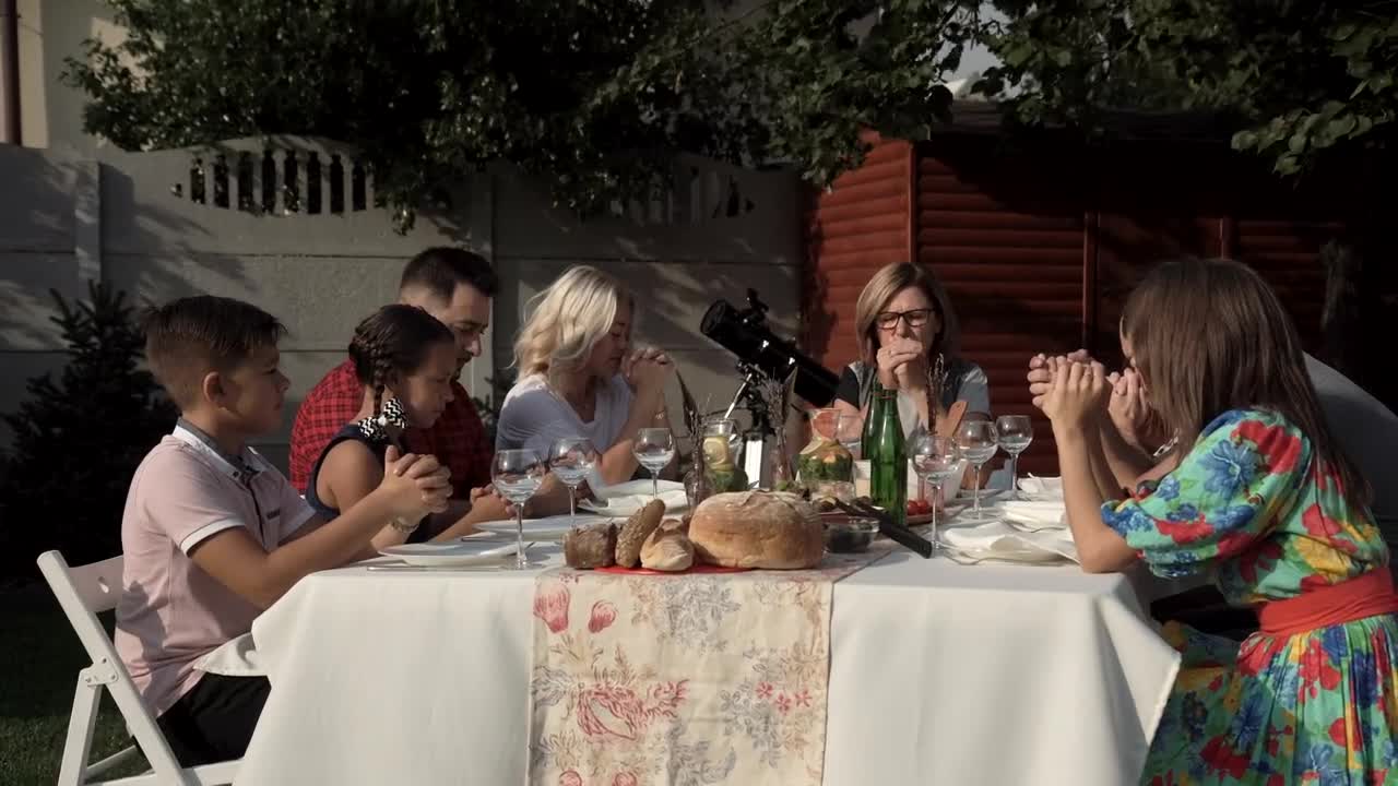 Stock Video Family Praying Before The Meal In The Garden Live Wallpaper For PC