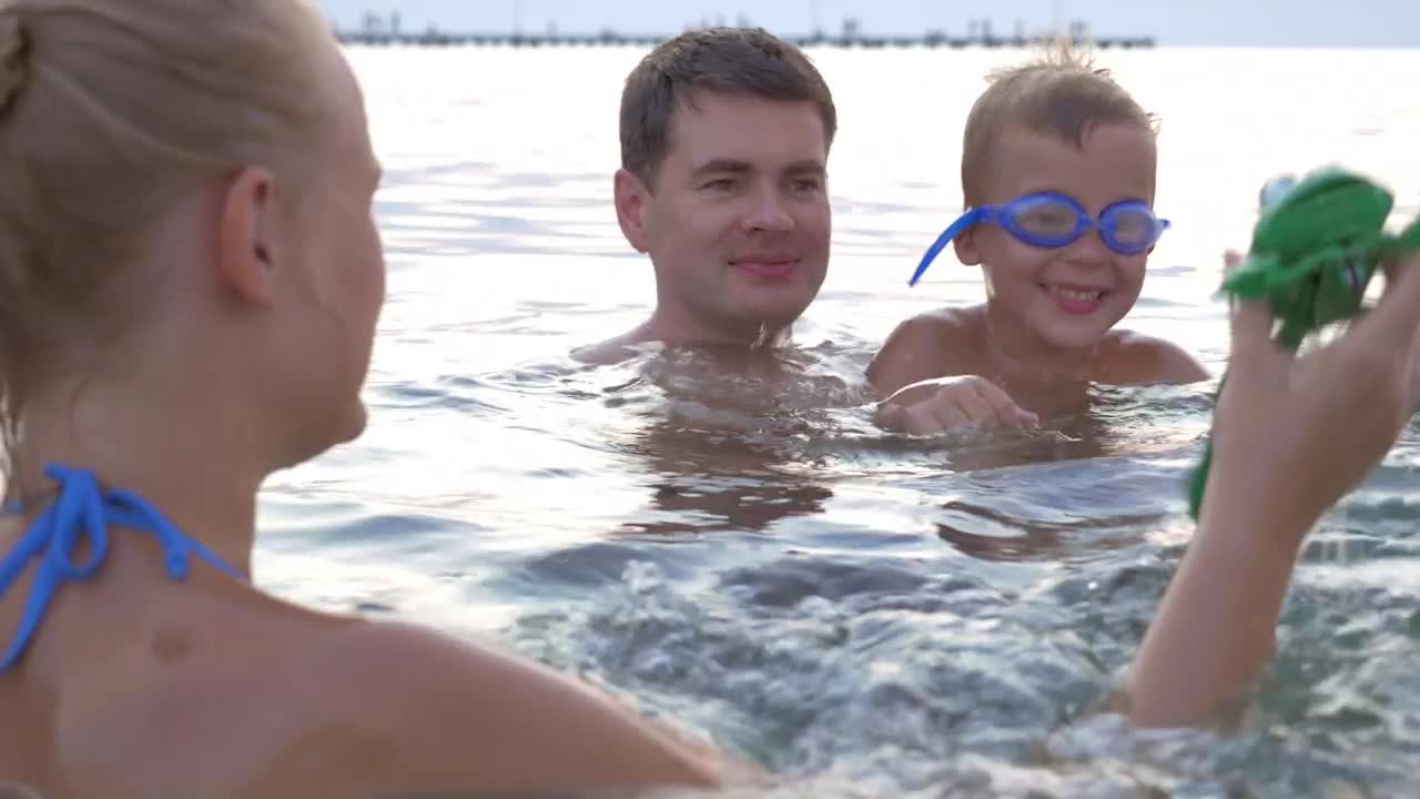 Stock Video Family Playing With A Toy In The Ocean Live Wallpaper For PC