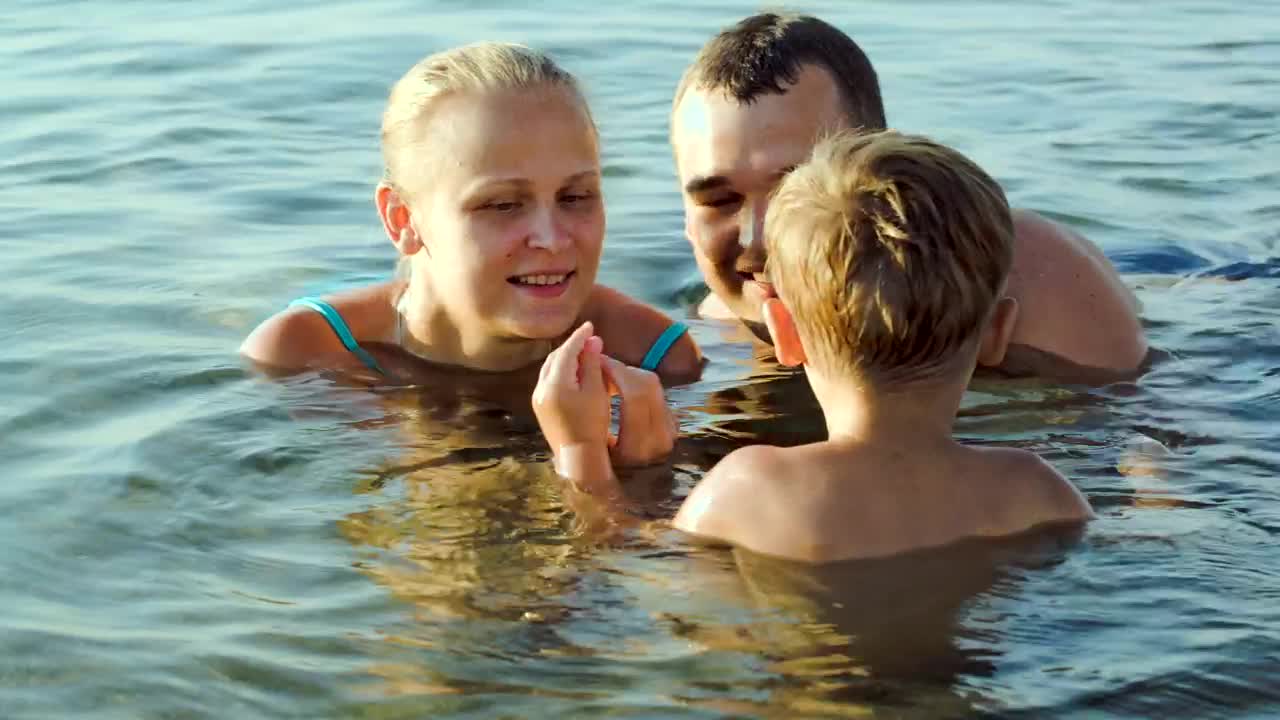 Stock Video Family Playing In Shallow Water Live Wallpaper For PC
