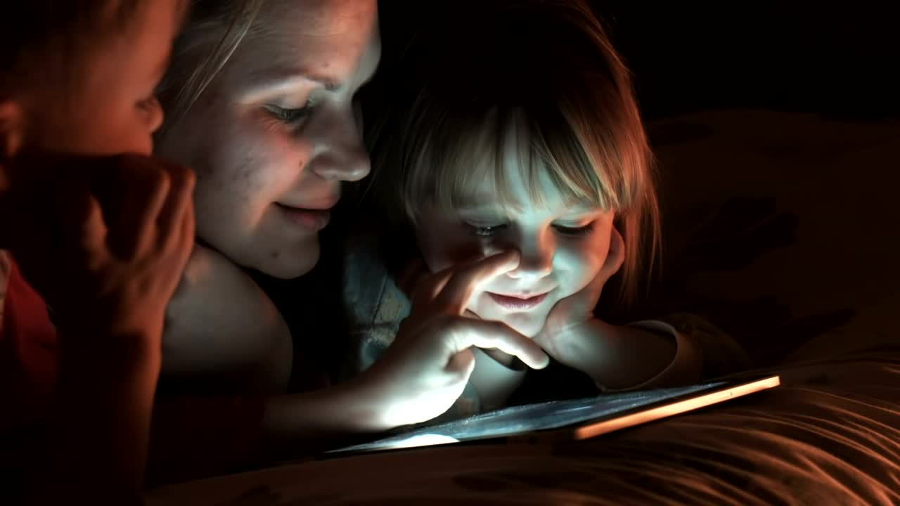 Stock Video Family Of Three Watching The Tablet In The Bedroom Live Wallpaper For PC