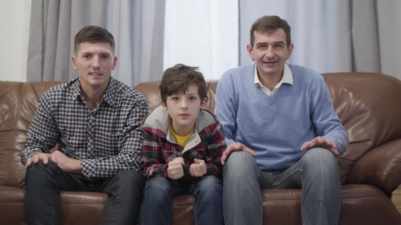 Stock Video Family Of Football Fans Cheer On Sofa Watching Game Live Wallpaper For PC