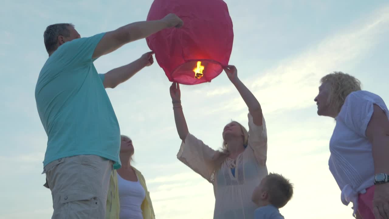 Stock Video Family Launching A Lantern Live Wallpaper For PC