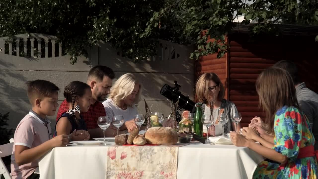 Stock Video Family In A Table Outdoors Praying Before The Meal Live Wallpaper For PC