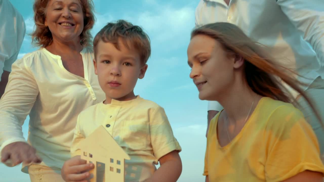 Stock Video Family Holding A Wooden House Live Wallpaper For PC