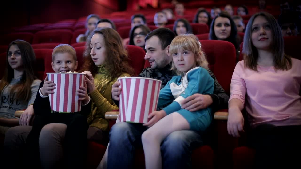 Stock Video Family Enjoying A Movie At The Cinema Medium Shot Live Wallpaper For PC
