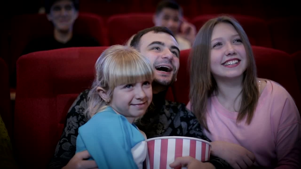 Stock Video Family Enjoying A Movie At The Cinema Live Wallpaper For PC
