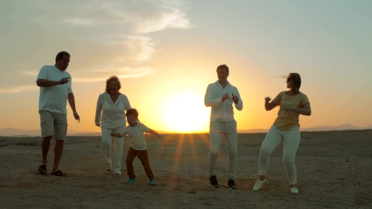 Stock Video Family Dancing At The Beach During Sunset Live Wallpaper For PC
