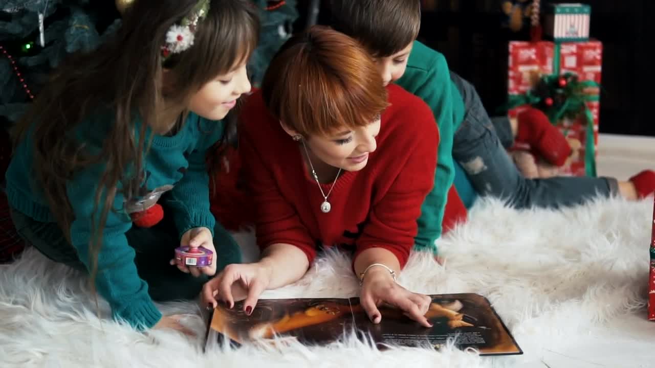 Stock Video Family Celebrates Christmas With Cuddle Near Tree Live Wallpaper For PC