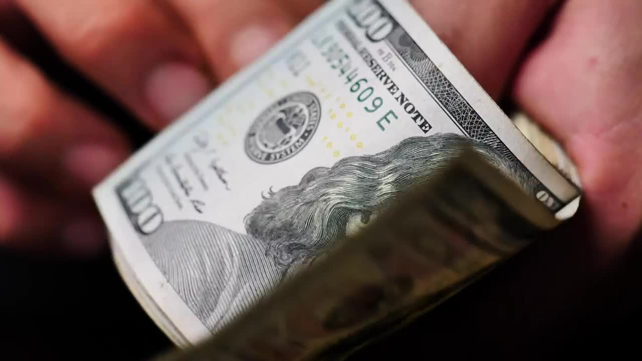 Stock Video Hands Flipping Through A Wad Of Dollars Seen Very Close Live Wallpaper For PC