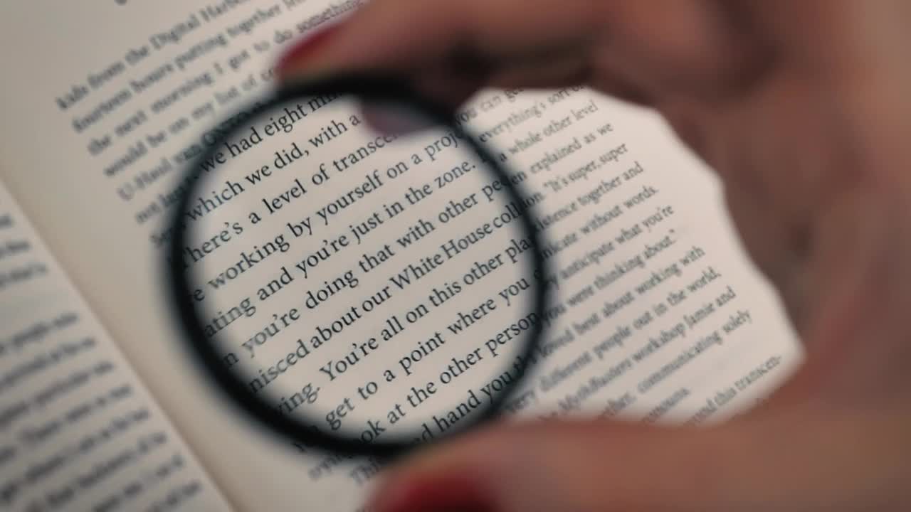 Stock Video Hand Of A Person Using A Magnifying Glass To Read Live Wallpaper For PC