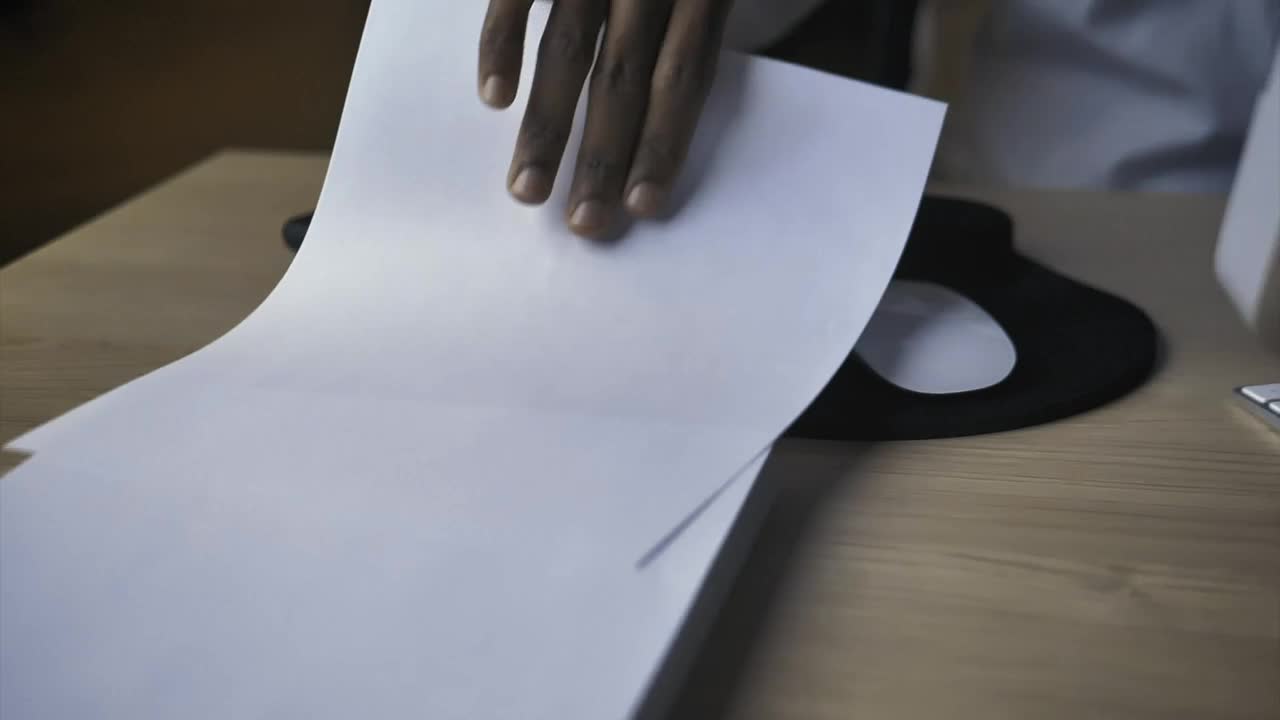 Stock Video Hand Of A Person Taking A Blank Sheet Of Paper Live Wallpaper For PC