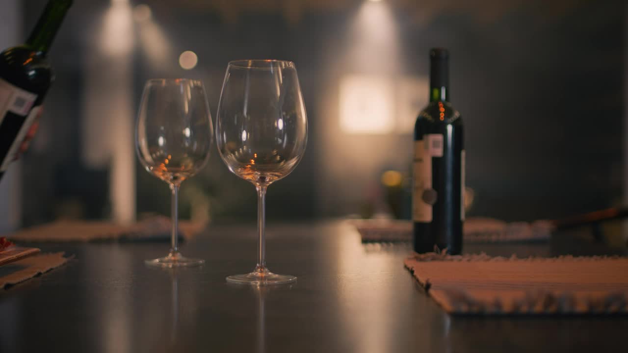 Stock Video Hand Of A Person Serving Wine In Two Glasses Live Wallpaper For PC