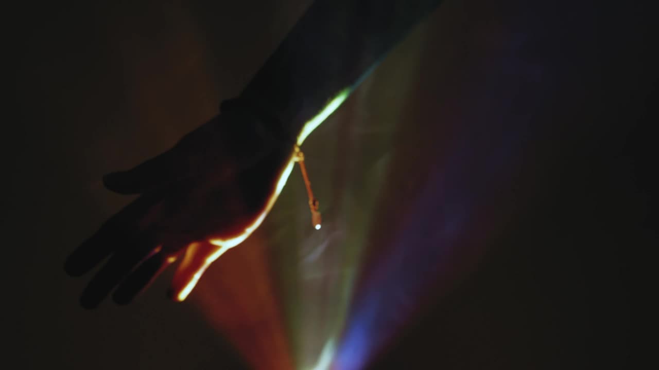 Stock Video Hand Of A Person In The Dark Through Colored Lights Live Wallpaper For PC