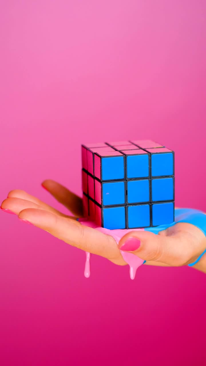 Stock Video Hand Holding A Rubik Cube That Seems To Melt On Live Wallpaper For PC