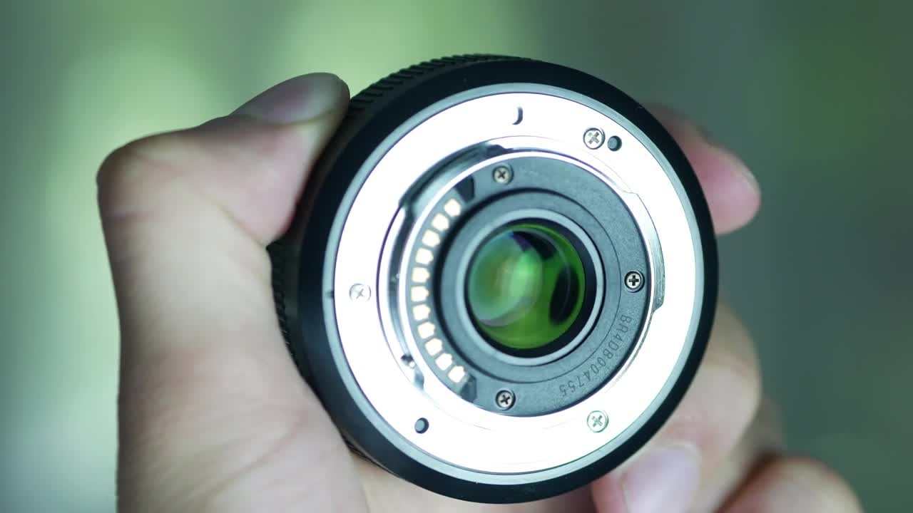 Stock Video Hand Holding A Camera Lens Live Wallpaper For PC