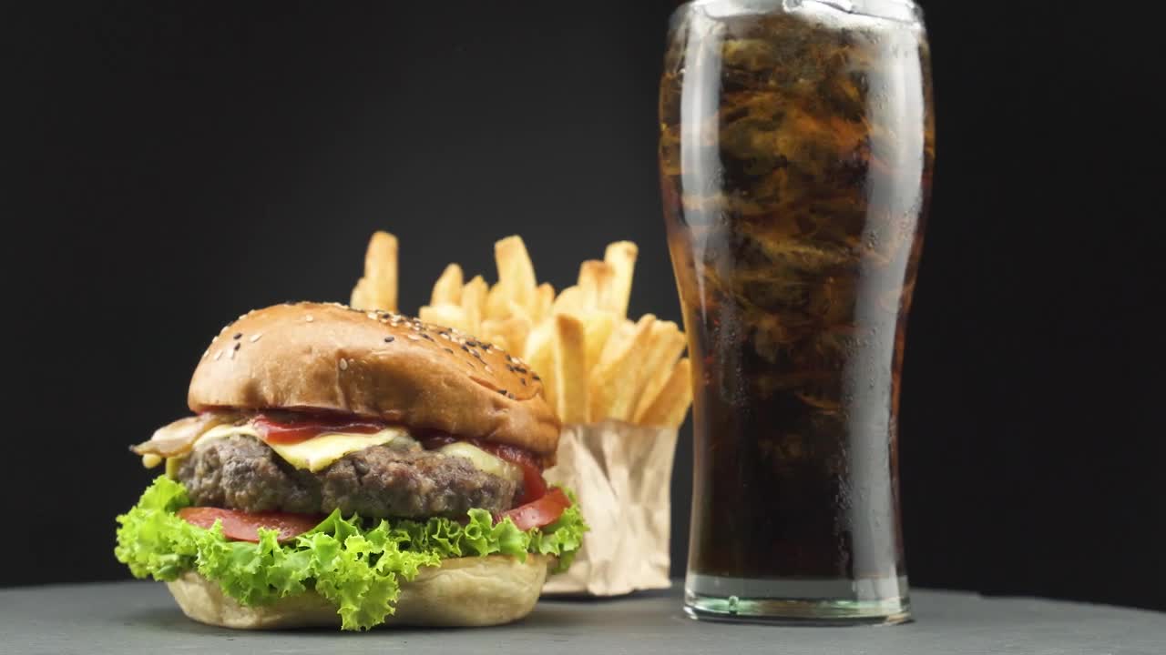 Stock Video Hamburger With Fries And A Soda On A Dark Background Live Wallpaper For PC