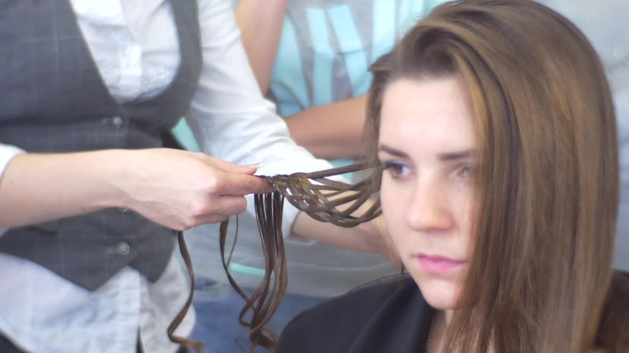 Stock Video Hairstylist Weaving A Bread In A Model Live Wallpaper For PC