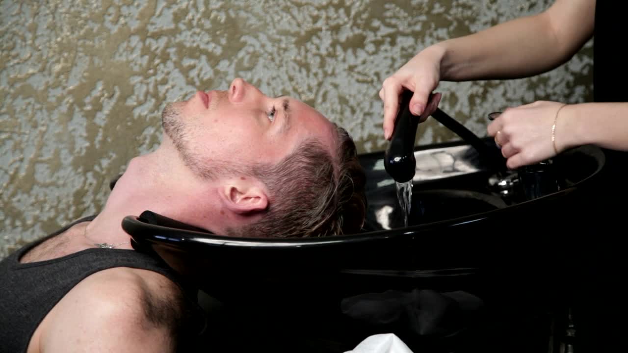 Stock Video Hairdresser Washing A Mans Hair Live Wallpaper For PC