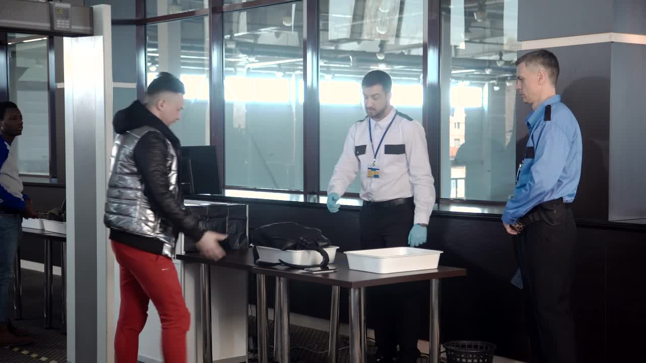 Stock Video Guard Inspecting A Passenger Bag At The Airport Live Wallpaper For PC